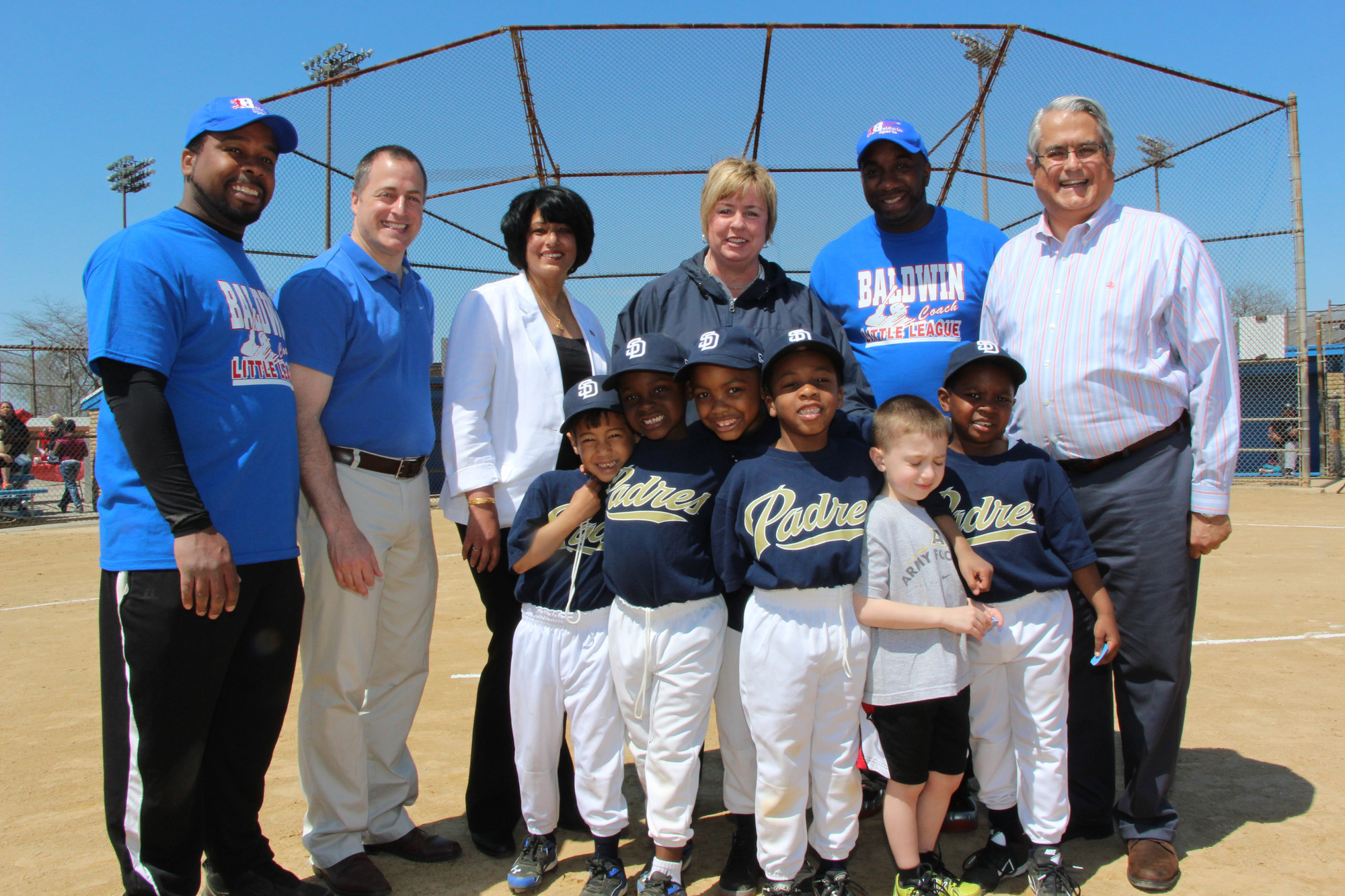 Baldwin Little League held its annual Opening Day cermonies on May 3 at Baldwin Park and it was quite the success, with a large turnout and sunny skies. Pictured from the Padres, a team of 6 and 7 year olds, were, from left. Garri Williams Jr., Cameron Myles, Luke Freymann, Benjamin Addzi, Jordon Andreula and Jayden Johnson. The back row from left is coach Garris Williams,  Assemblyman Brian Curran, Town of Hempstead Clerk Nasrin Ahmad, Town of Hempstead Supervisor Kate Murray, coach Lateef Williams and Town of Hempstead Councilman Anthony Santino.