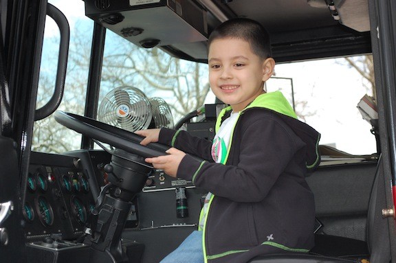 Damian Mazariego, 5, got to sit in the cab of a Valley Stream fire engine last Friday afternoon.