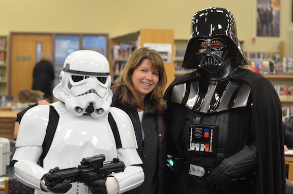Grace Hatton with a Storm Trooper and Darth Vader at the library.