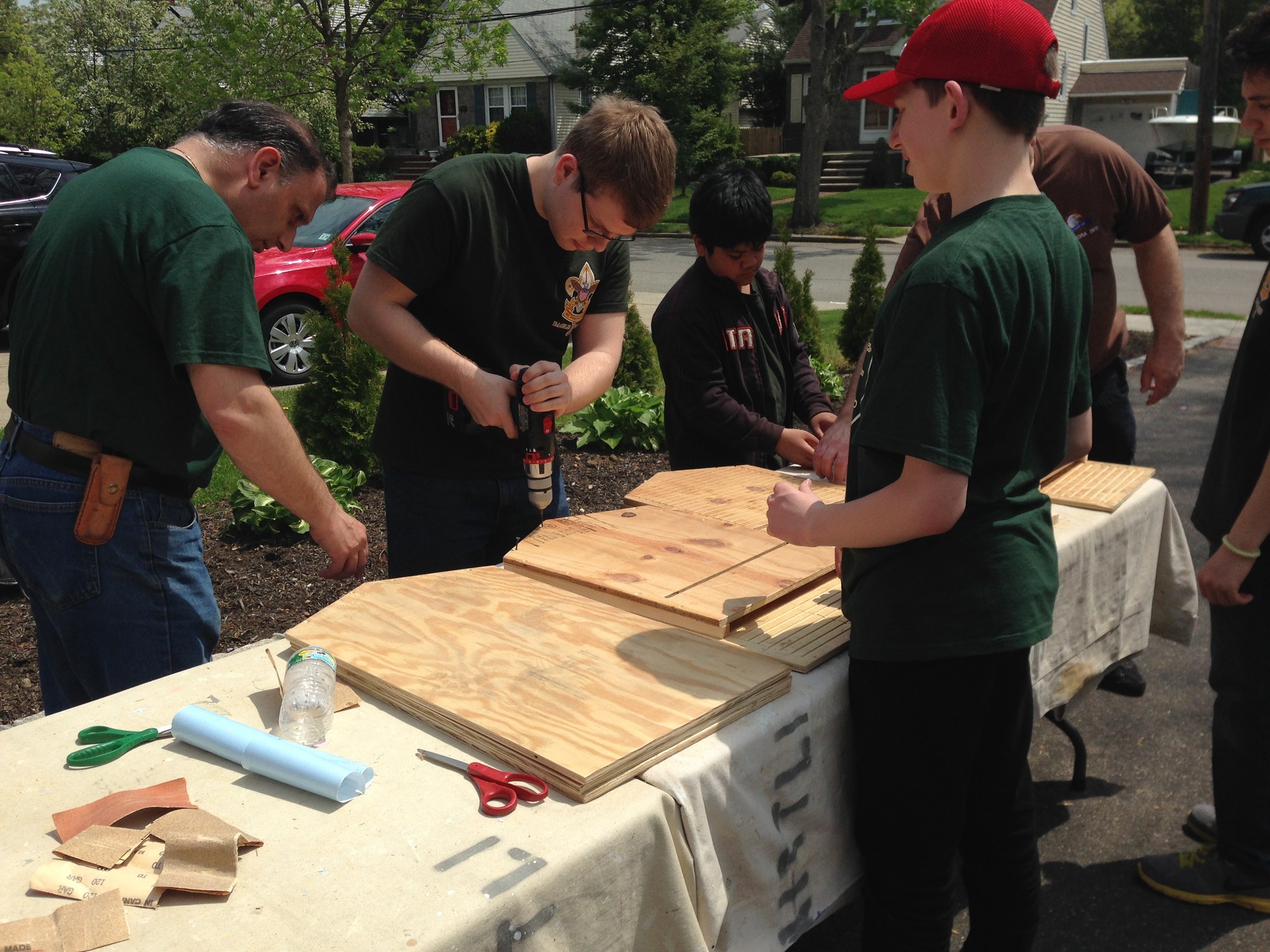 Volunteers help David Glaittli construct bat boxes for the Village of Valley Stream.