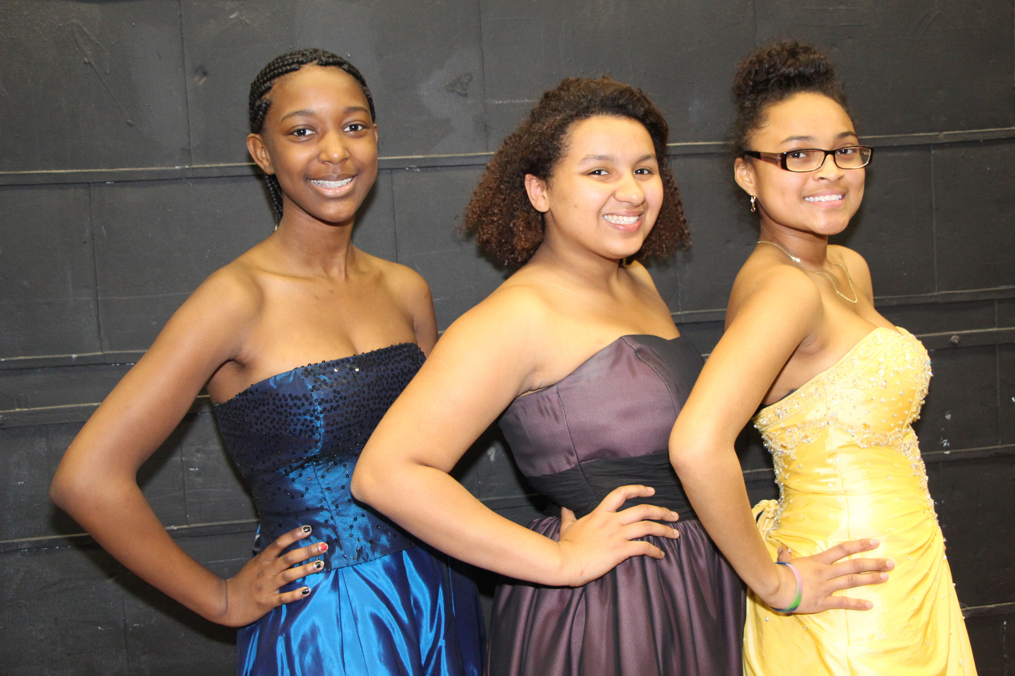 Breannah Bernard, 15, left, Tiffany steele,15, center, and Mitinah Caesar, 14, tried on a few gowns and dresses.