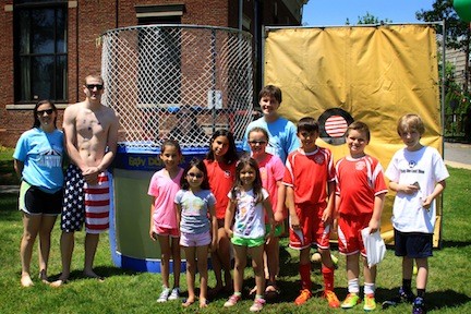 Volunteers and students had fun dropping staff into the dunk tank.
