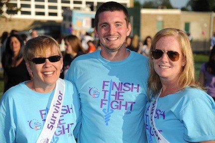 Co-chairs Laurie Faust, left, and Kelly Murray, right, with Chris Tellarico, of the American Cancer Society.