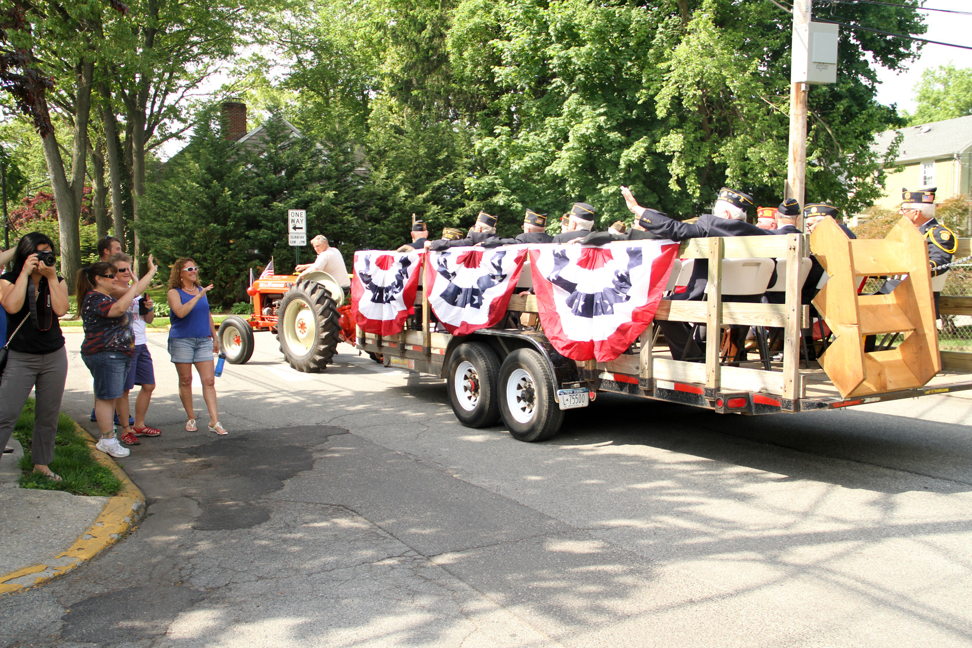 Malverne residents cheer as the Vets make their way thru the parade route.