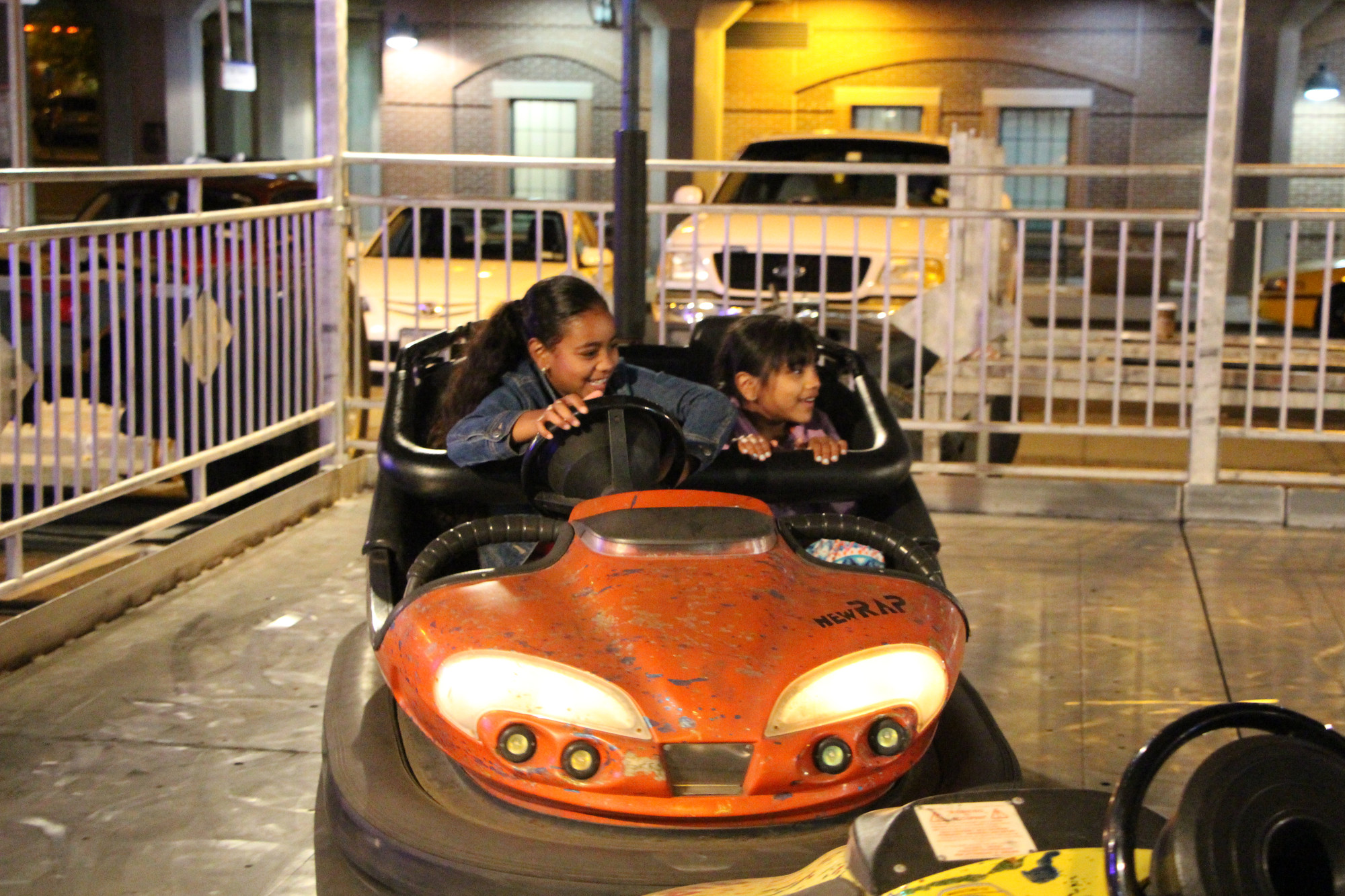 Sisters Valanie, 8, left, and Dezirae Wishropp, 6, drove bumper cars at the Baldwin Chamber of Commerce carnvial, which was held from May 29 to June 1 at the Long Island Rail Road station.
