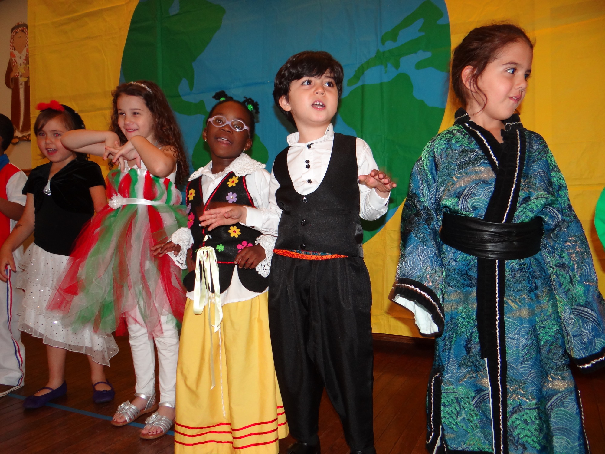 Students dressed up and sang songs for family members in attendance during the Community Nursery School of Baldwin’s international show on May 22.