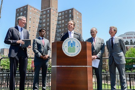 Governor Andrew Cuomo, center, was joined by New York Mayor Bill DeBlasio, left, Vice President for Initiatives and Strategy of the Rockefeller Foundation Zia Kahn, U.S. Senator Charles Schumer and HUD Secretary Shaun Donovan to announce the winners of the Rebuild by Design competition.