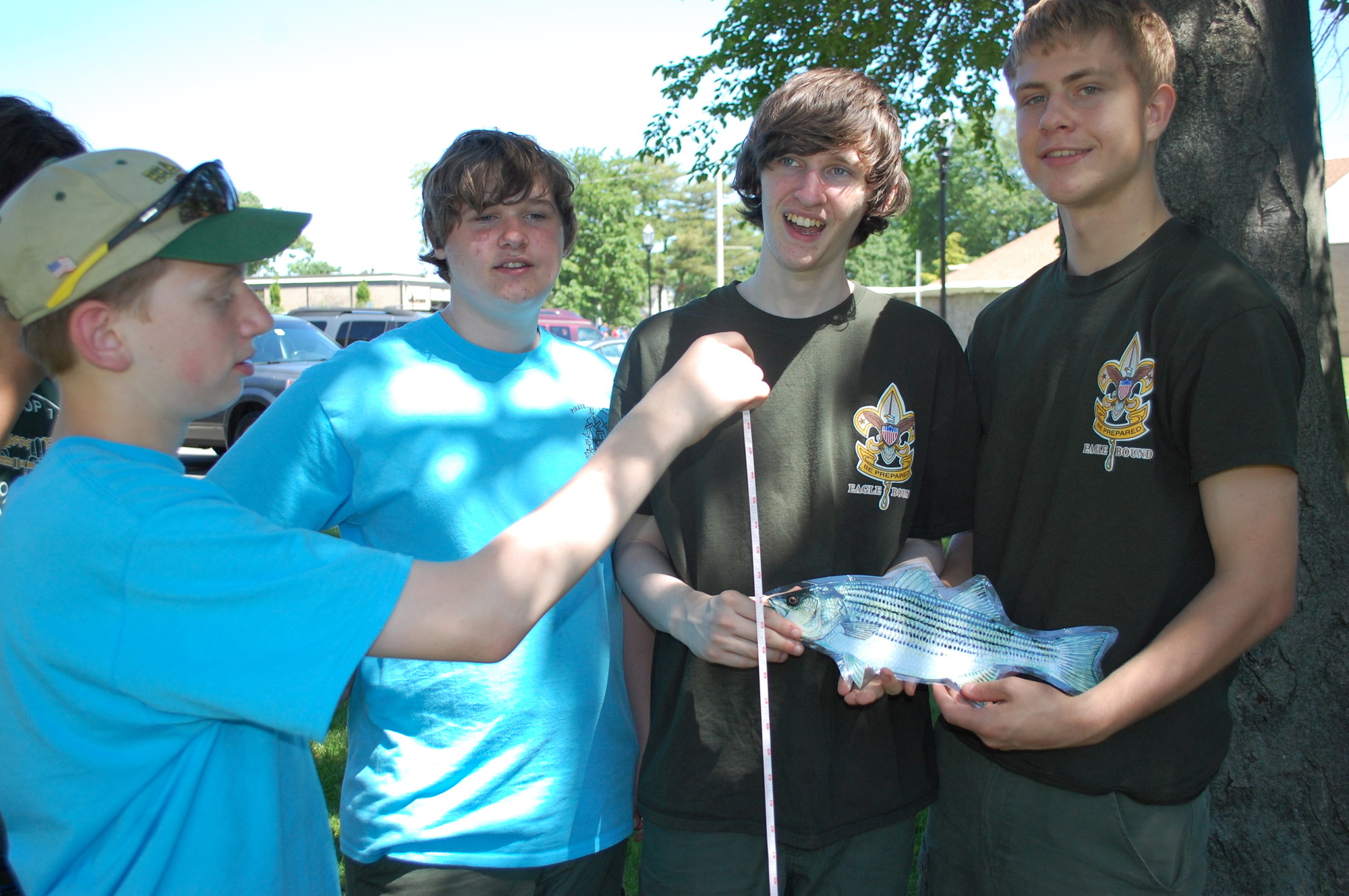 Troop 116 Boy Scouts, from left, Jason Bitteto, Chris Raffloer, Billy Raffloer and Ryan Plackis learned about fish.