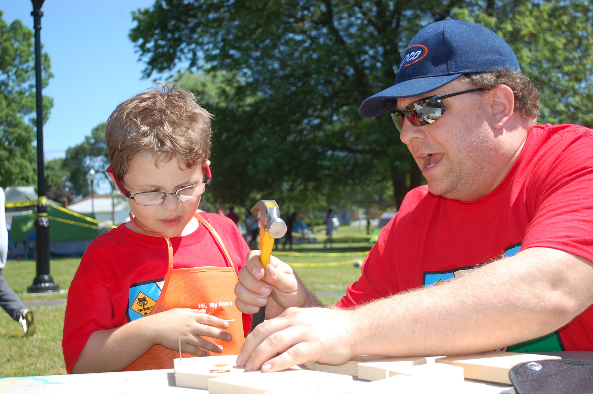 Sean Leon, 6, a Cub Scout from Pack 367, got some help from his father, Shawn, in building a birdhouse at the annual Valley Stream Scout Camporee held last weekend on the Village Green.