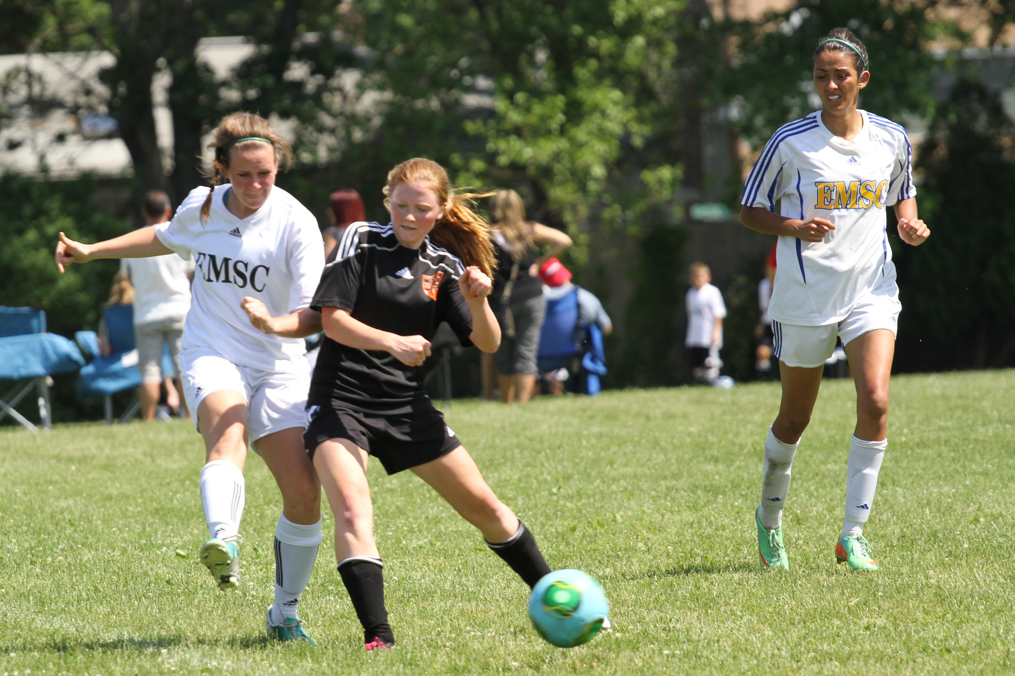 Megan Fischer, left, and Paige Werlau battled for a loose ball at Speno Park.