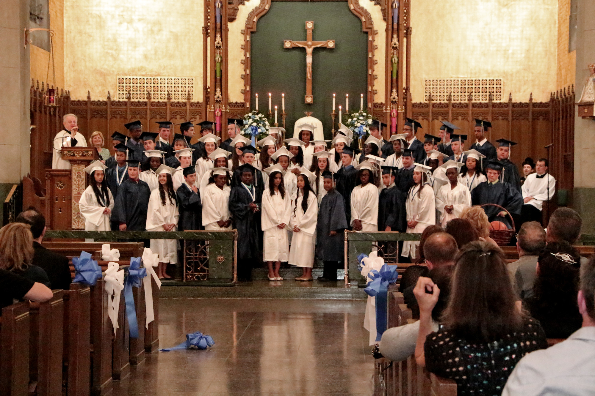 Graduates closed the cermoniy with a rendition of their school song.