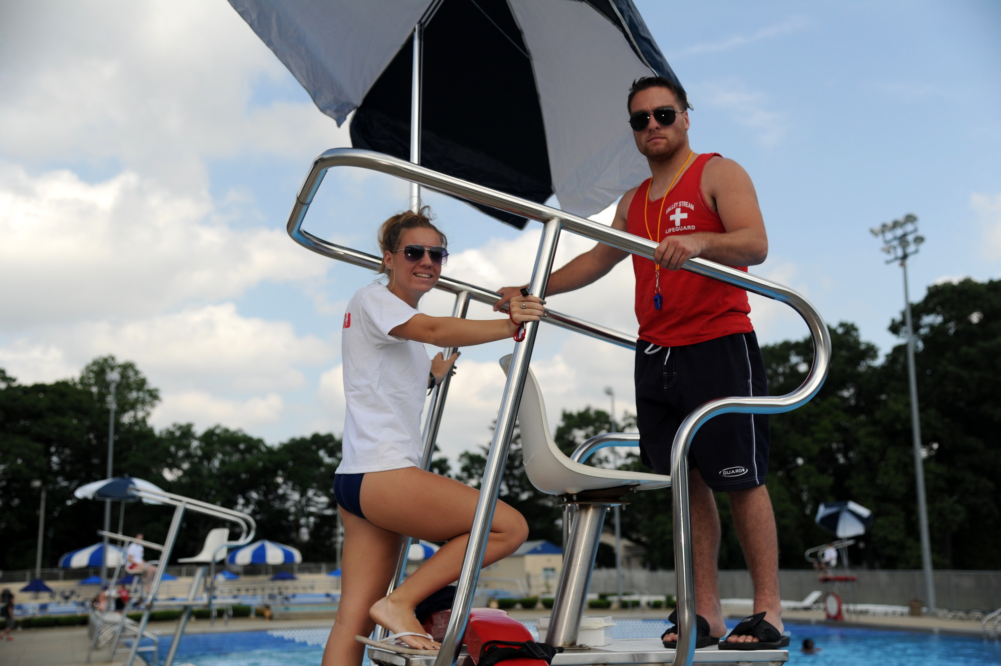 lifeguards Allison McConville and Joe Abruzzino watched over the water at the pool complex on opening day.
