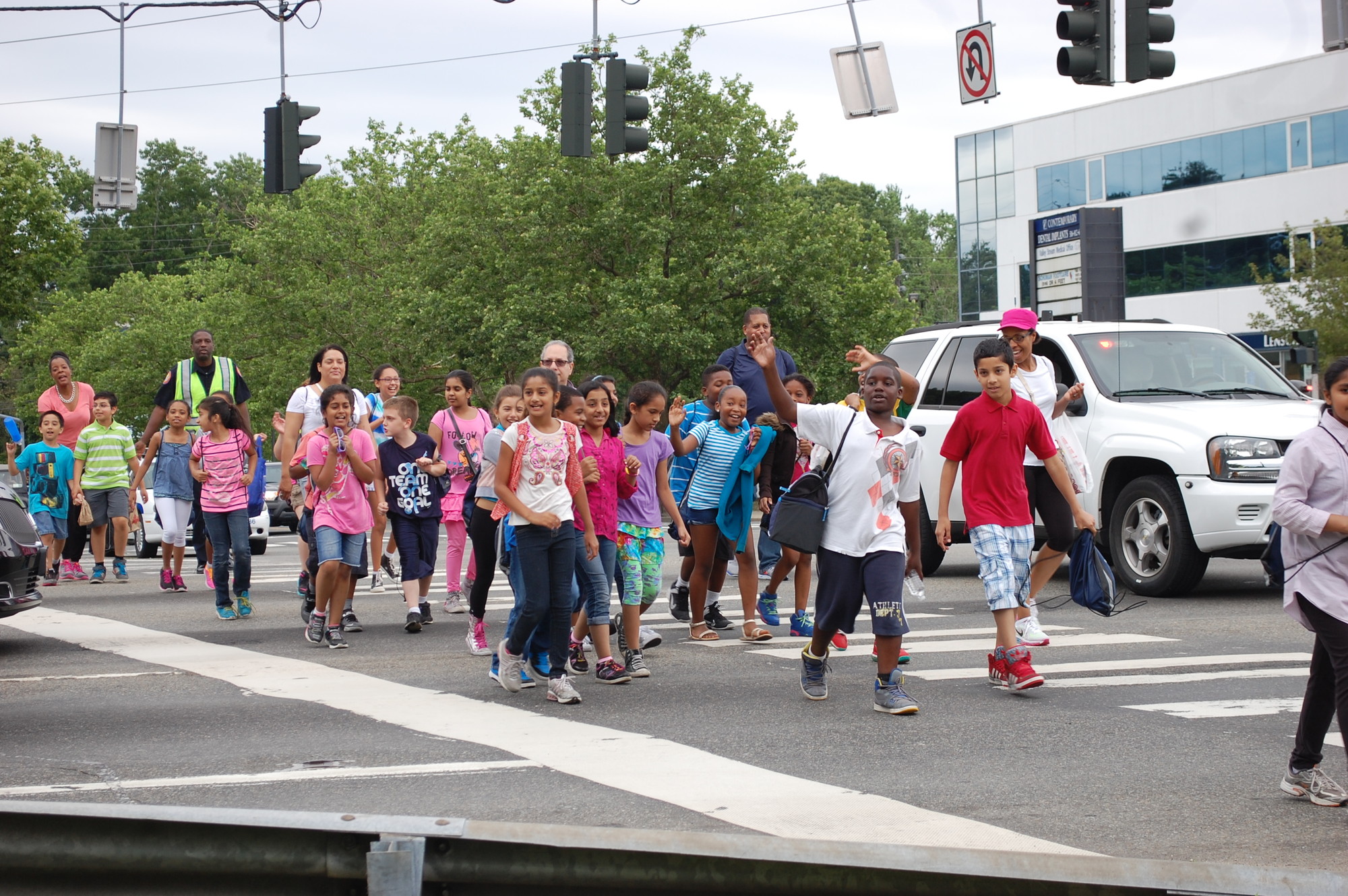 A group of students from Forest Road School crossed Sunrise during the tour, on their way to the Waldinger Library.