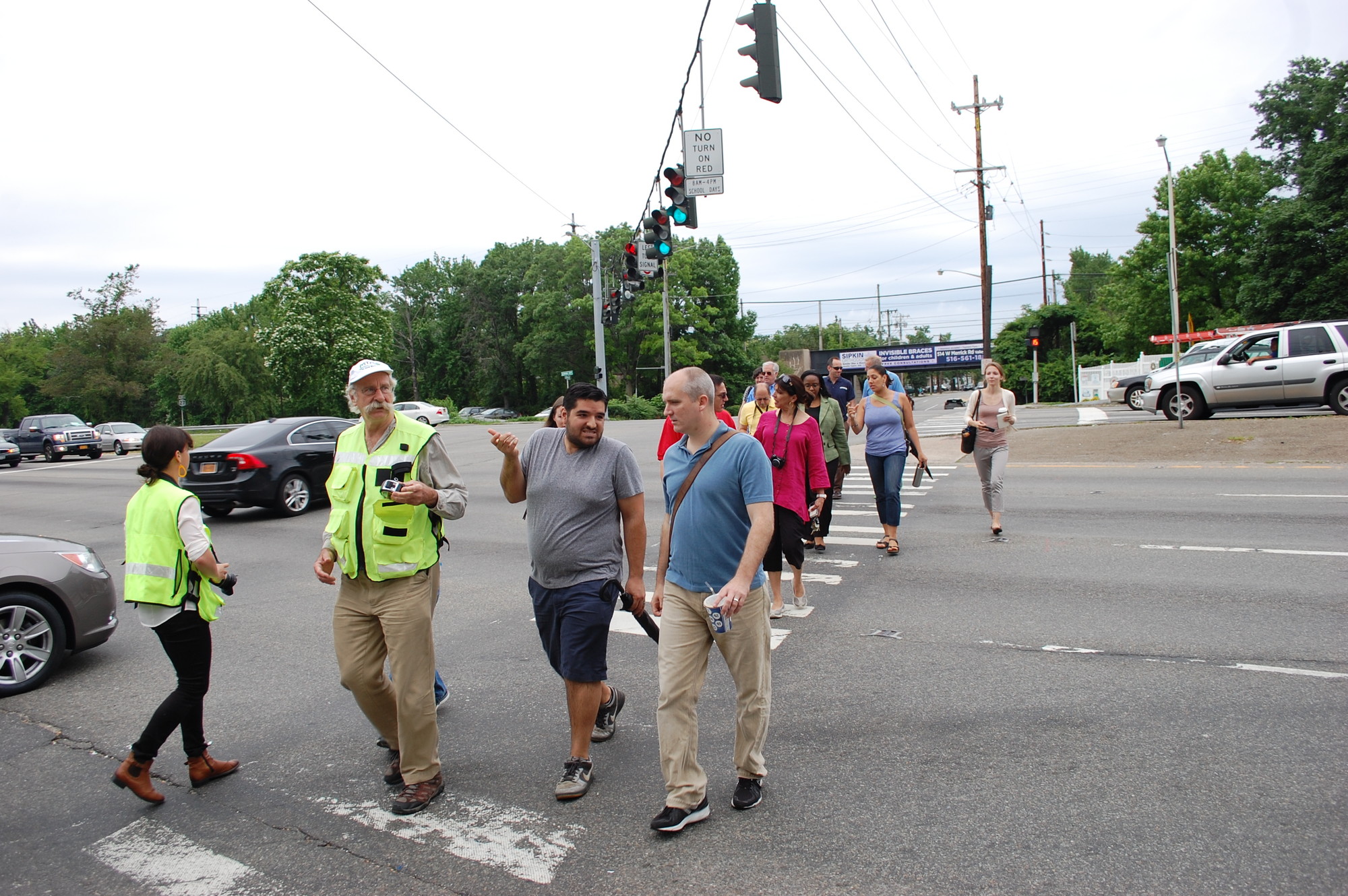 Transportation expert Dan Burden led a group of local leaders and residents across Sunrise Highway in Valley Stream on June 19 as part of a three-stop tour focusing on pedestrian safety along the major thoroughfare.