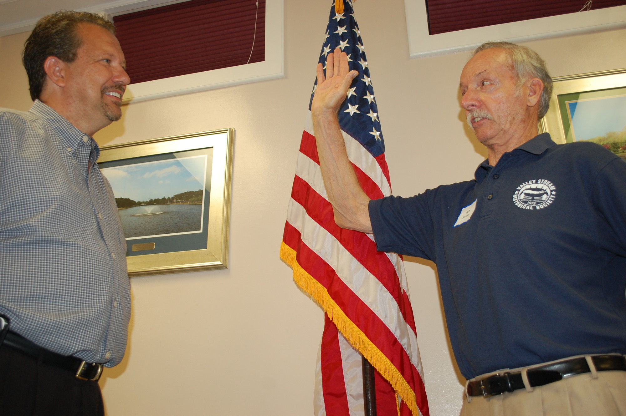 Guy Ferrara, right, was installed for another term as president by Valley Stream Mayor Ed Fare.