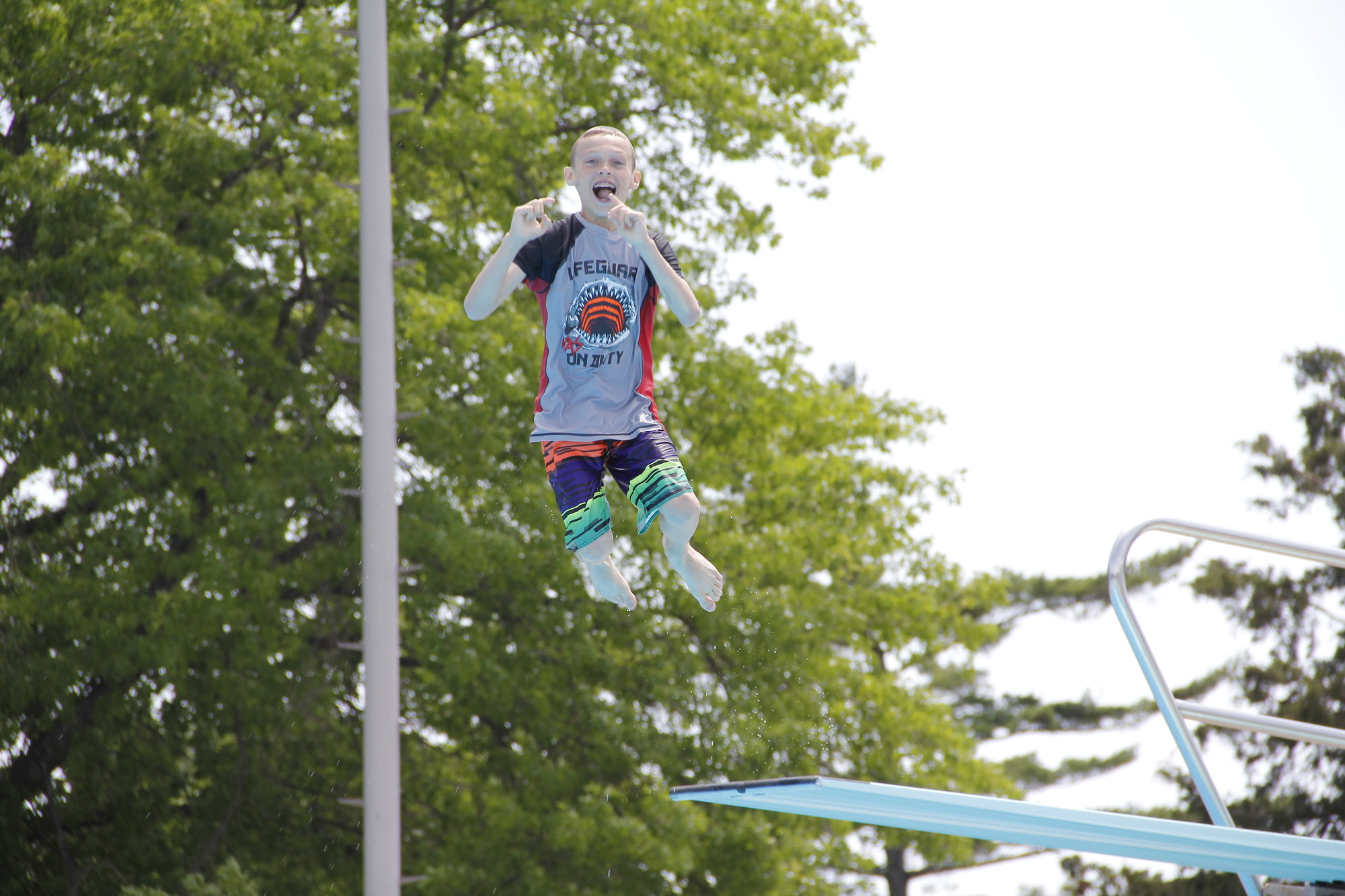 Anthony Cavanagh, 12, jumped, spun, dove and even posed for the camera on his various jumps off the diving board