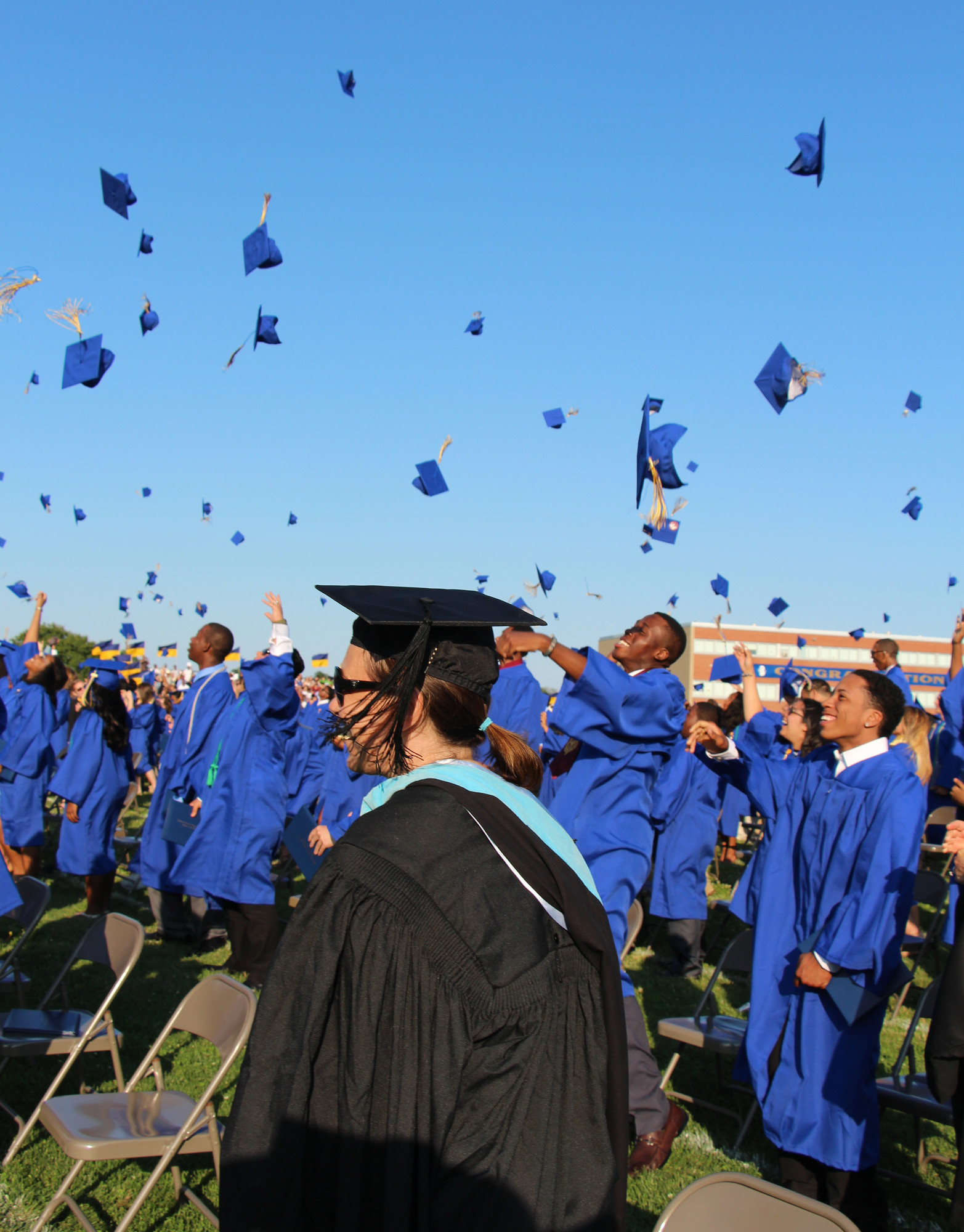Graduates tossed their hats and were all smiles on June 27.