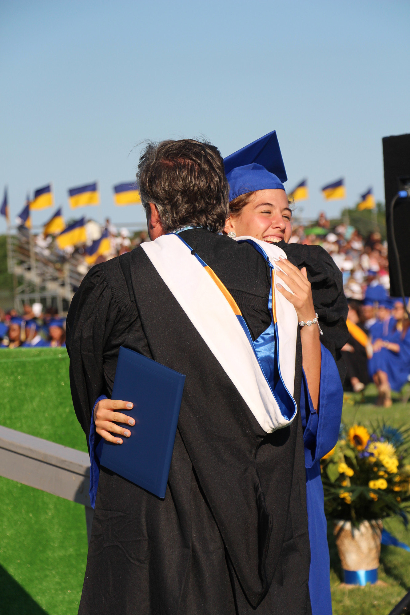 Brittney Scannell got her diploma, then got a big hug from her uncle, Superintendent James Scannell.