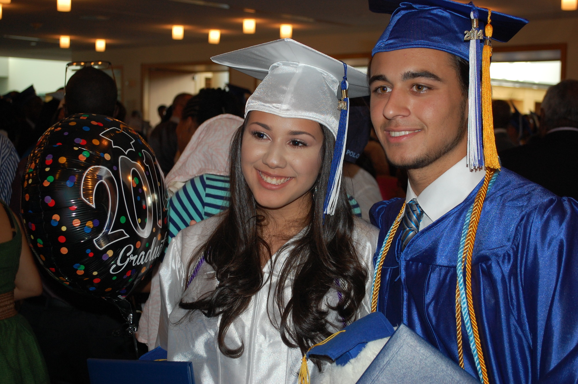 Elizabeth Espinal and Nicholas Bizzarro met up in the Tilles Center lobby after receiving their diplomas at Central High School’s 88th commencement ceremony.
