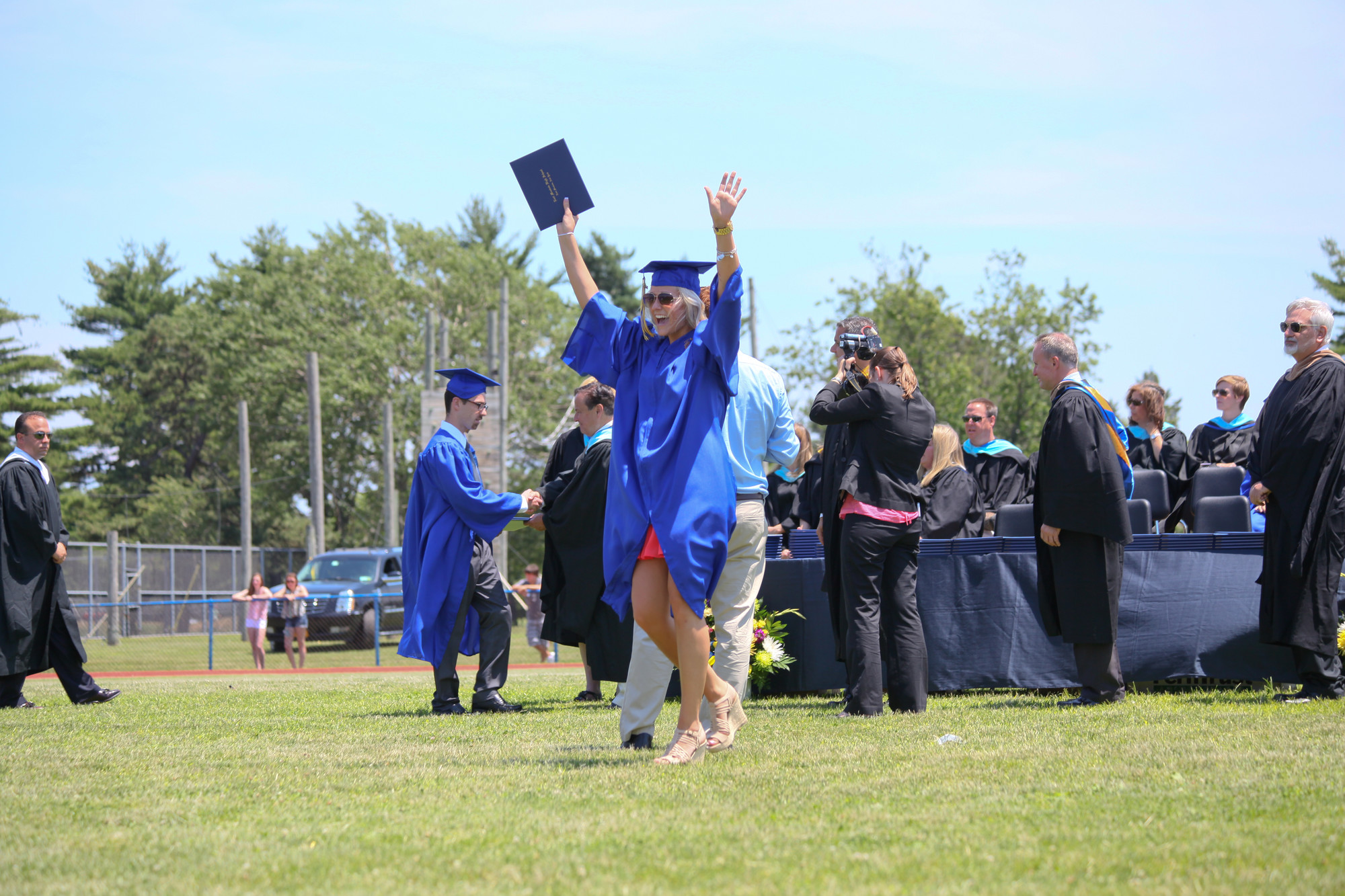 Students expressed their excitement after receiving their diplomas, like this young lady.