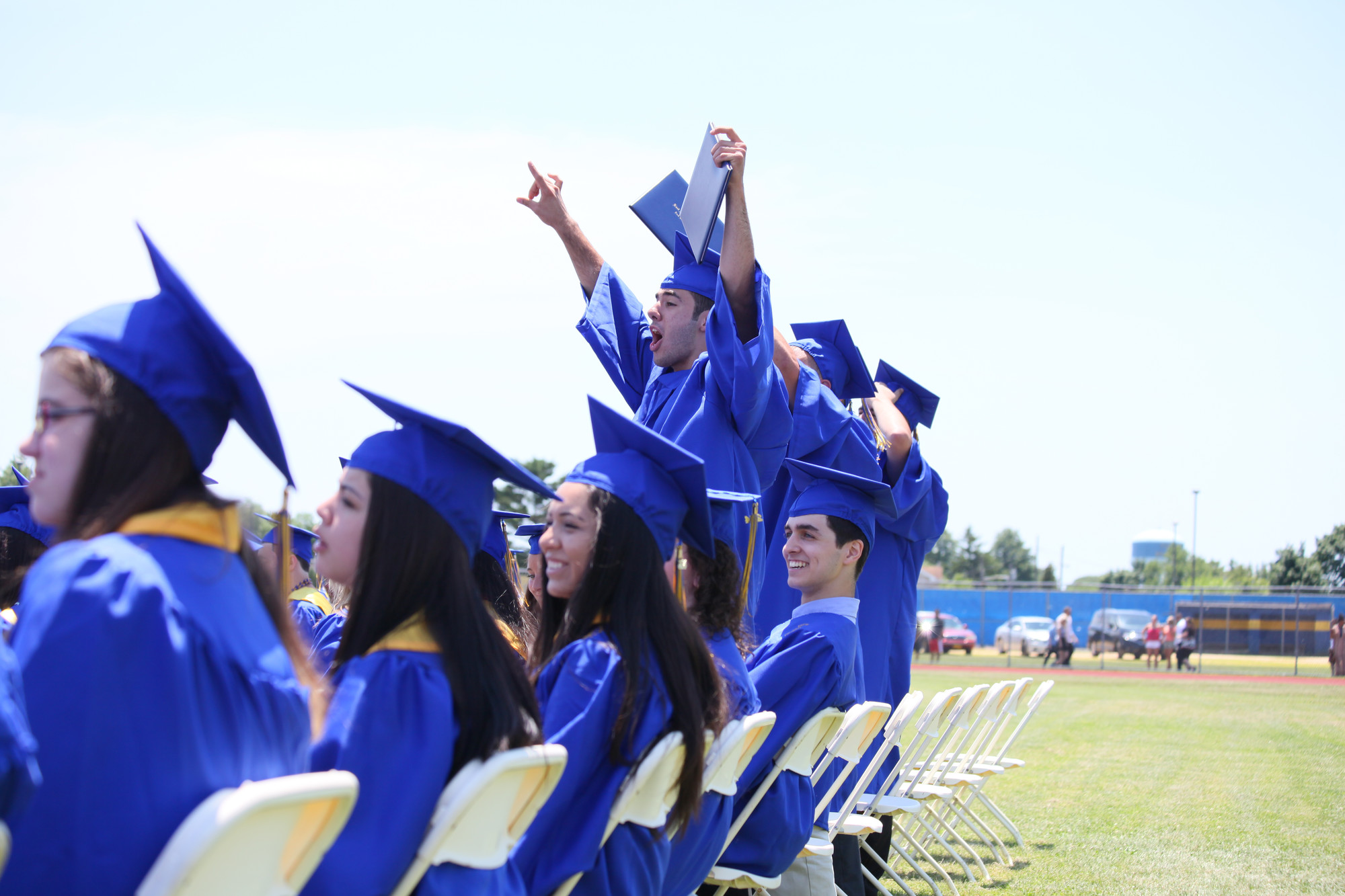 graduating seniors cheered as their classmates’ names were called to receive their diplomas.