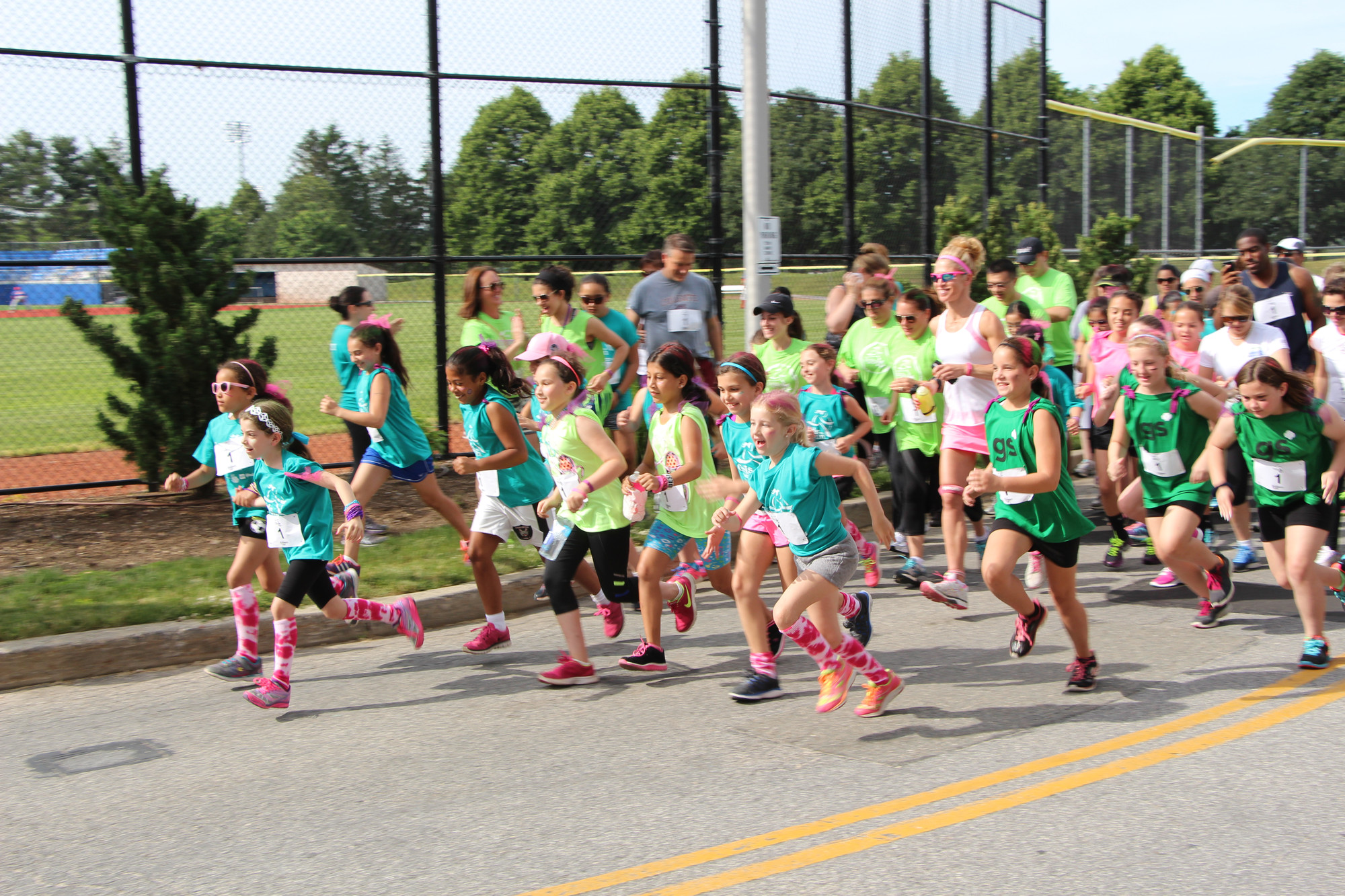 These girls were deteremined to have fun on the run. There were over 100 young girls who took off at the starting line.