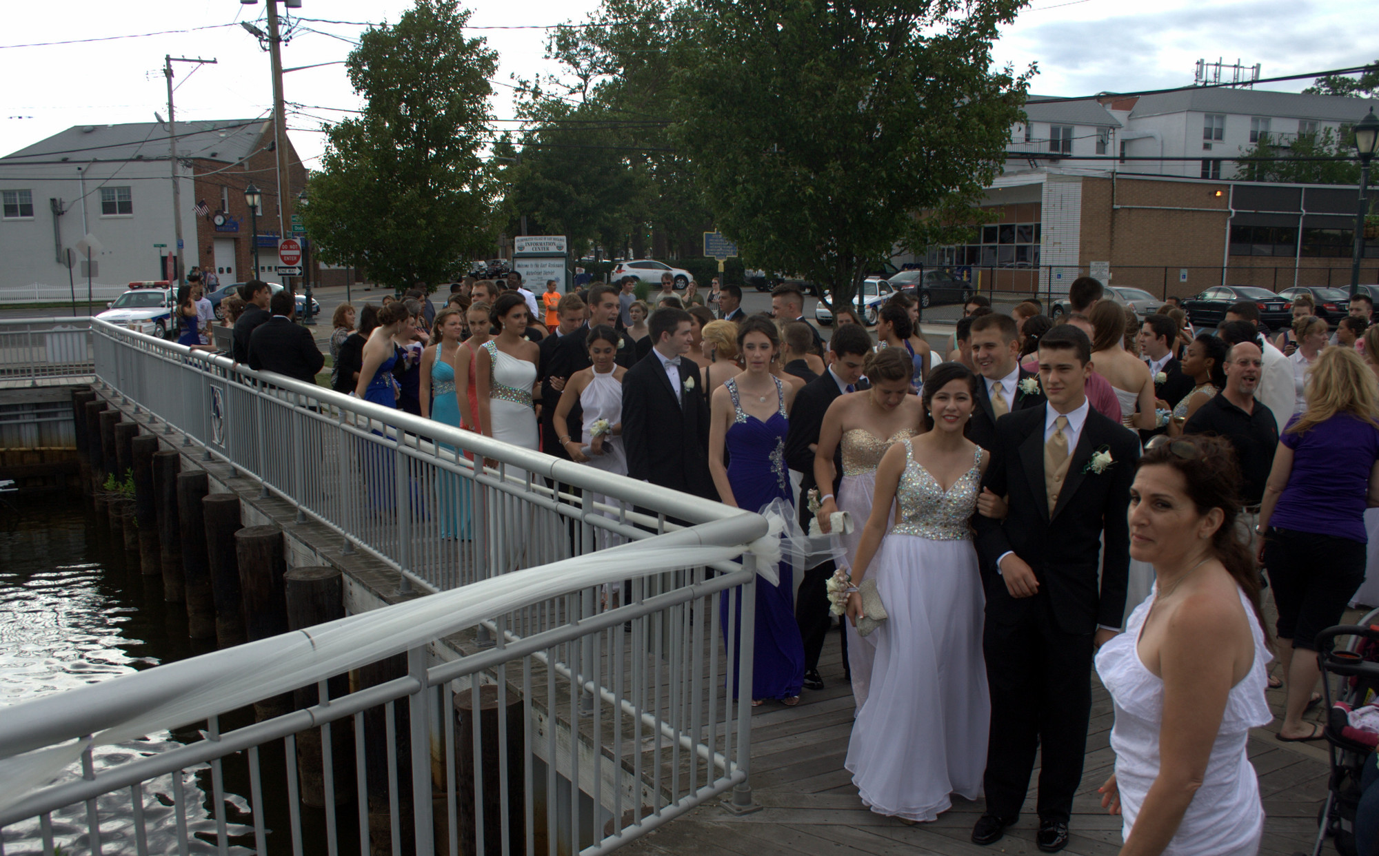 Dressed for their party, East Rockaway juniors, seniors and their guests walked along the waterfront to the delight of their waiting families and friends.