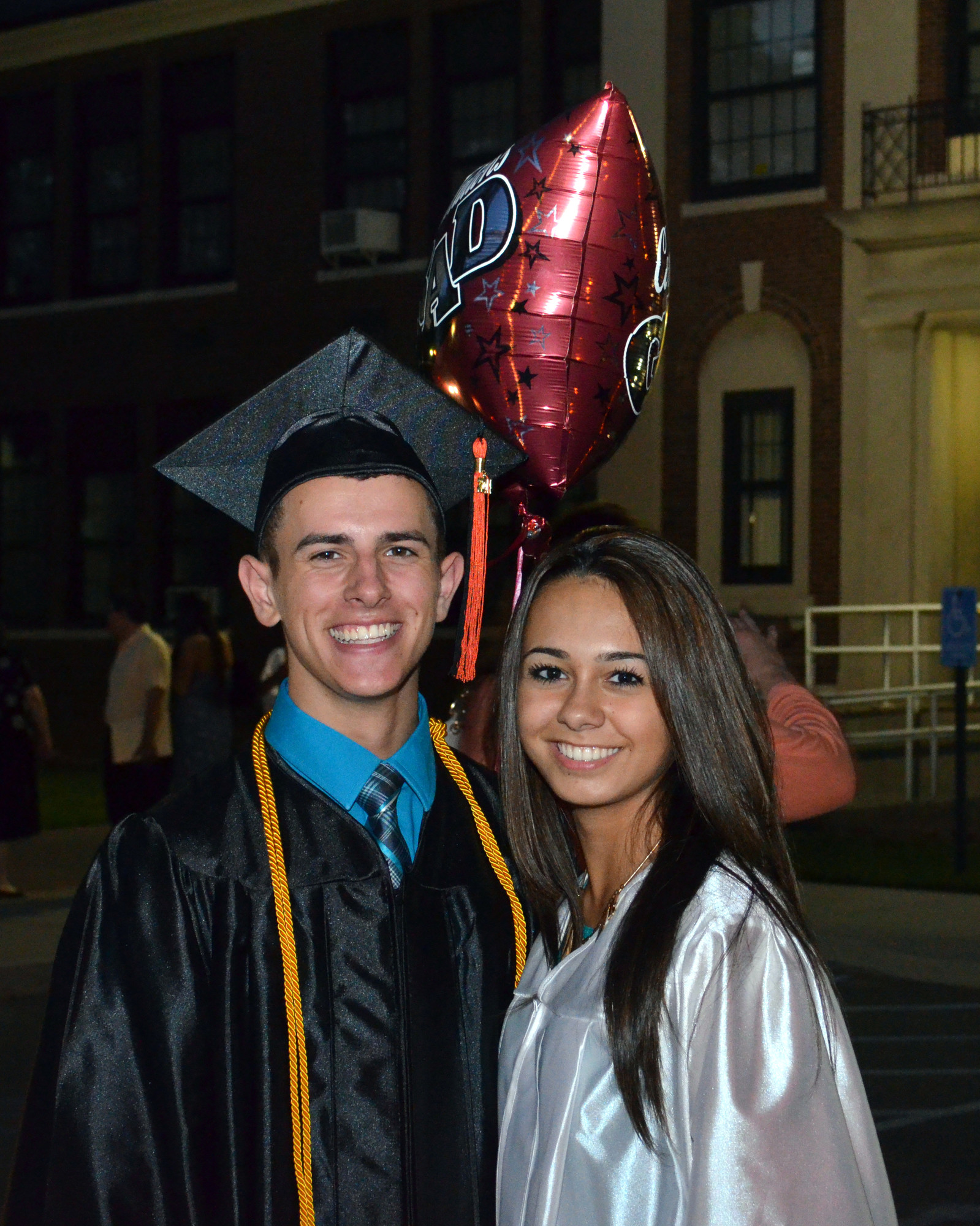 Class of 2014 students Garrett Caroff and Alexis Carlo greeted each other outside after the ceremony.