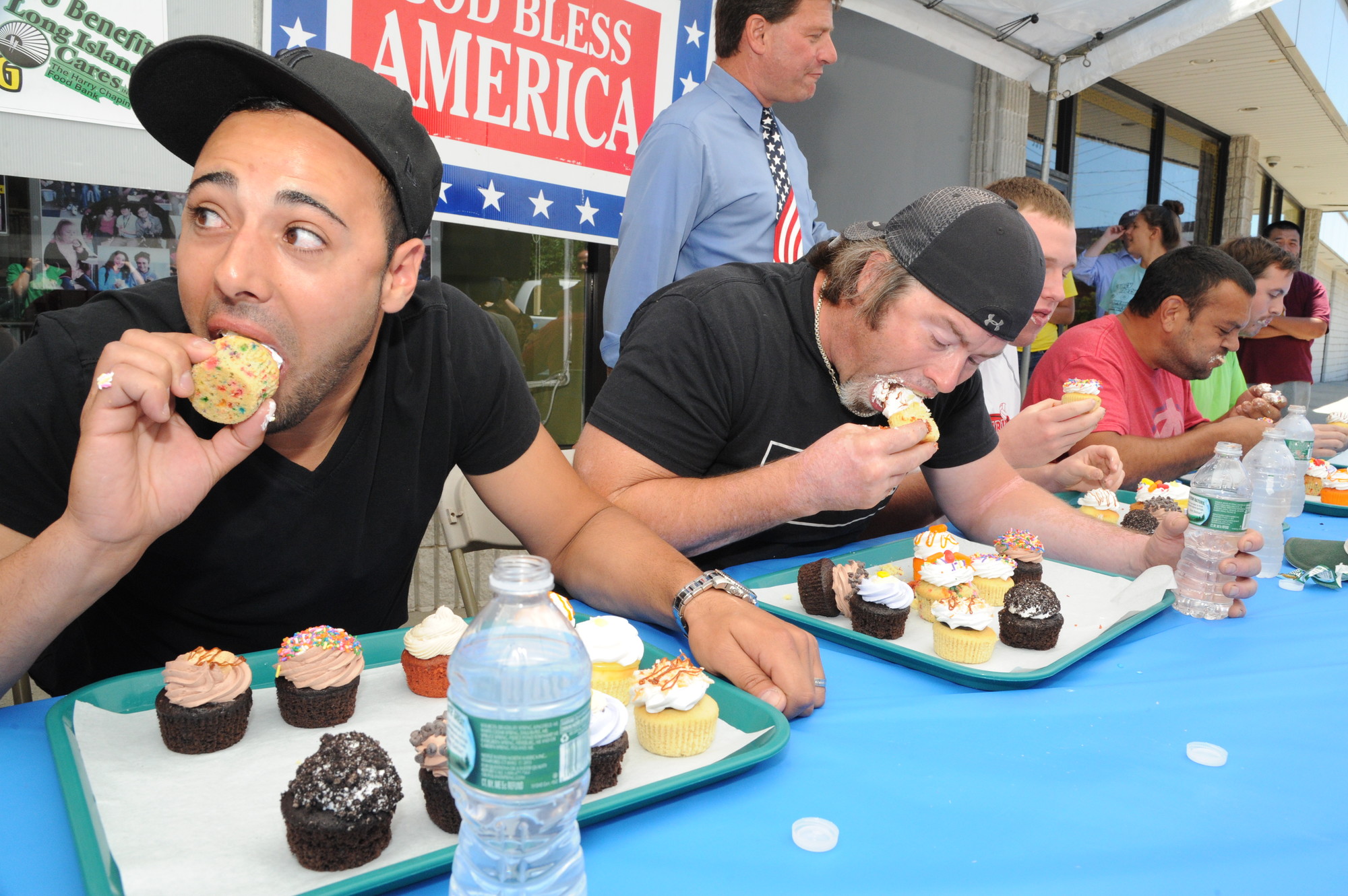 Joe Oppedisano, left, and the other competitors in the adult division chowed down last Saturday afternoon in hopes of winning the fourth annual cupcake-eating contest.