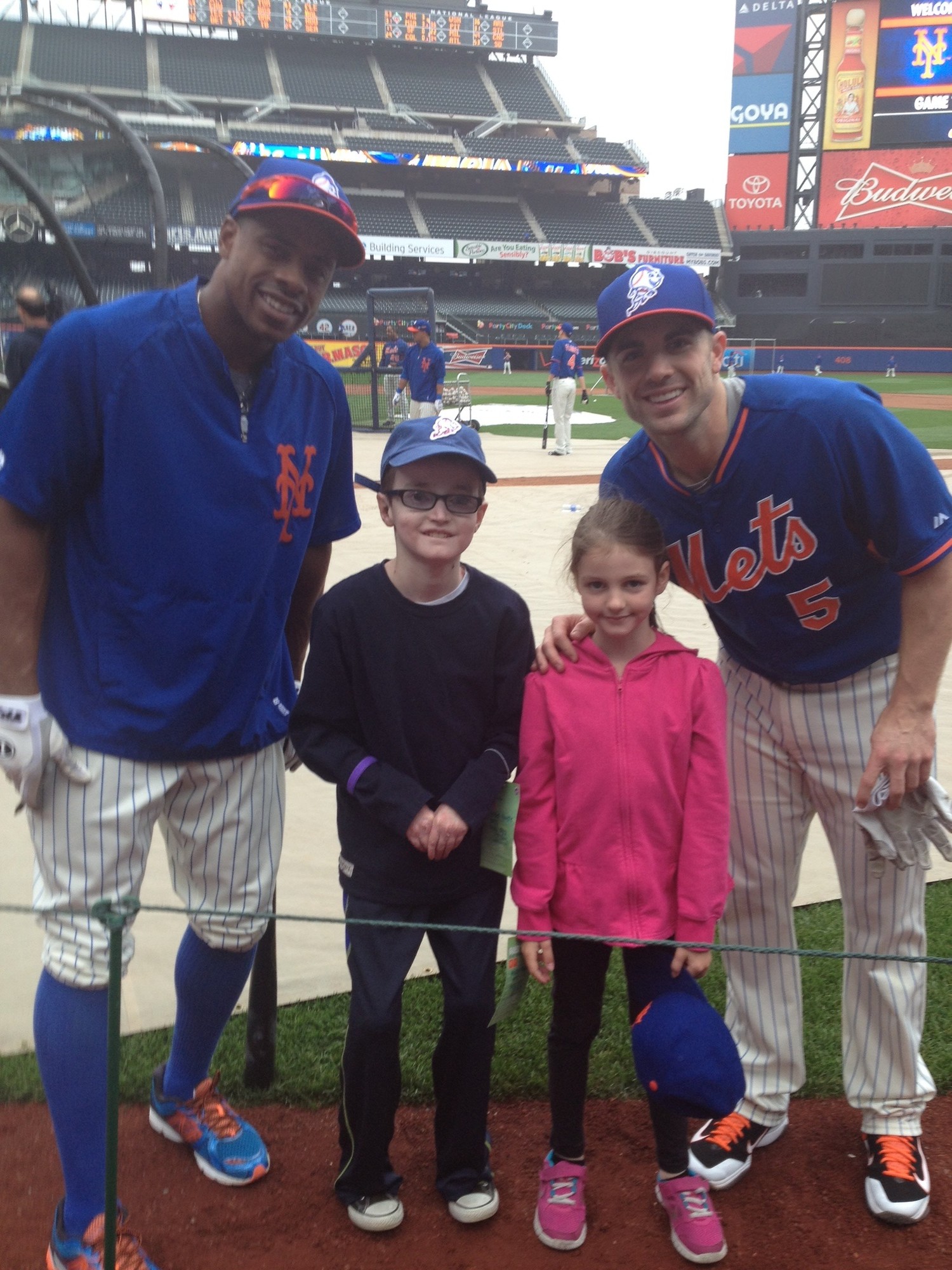 Robbie met New York Mets players David Wright and Curtis Granderson at Citi Field in May.