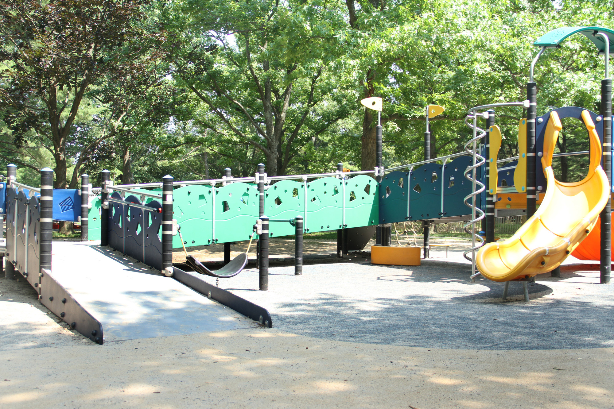 The playground features customized equipment that accommodates children who have special needs.