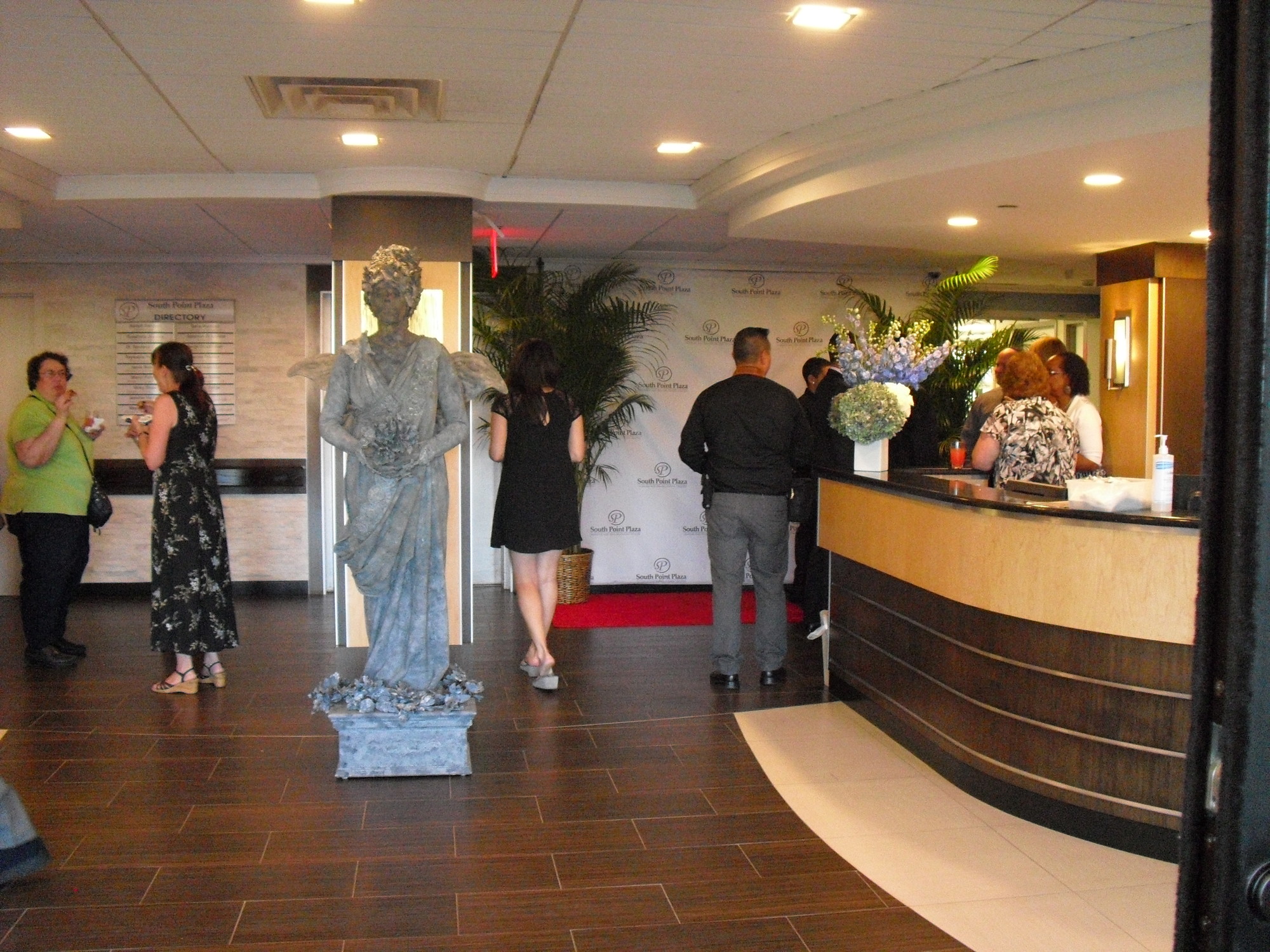 South Point Plaza’s reopened lobby, featuring a living statue.