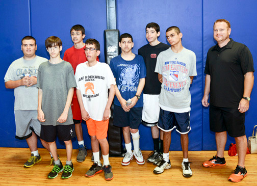 The Life skills students were greeted by ROK Health & Fitness co-owner Mike Hawksby, at far right.