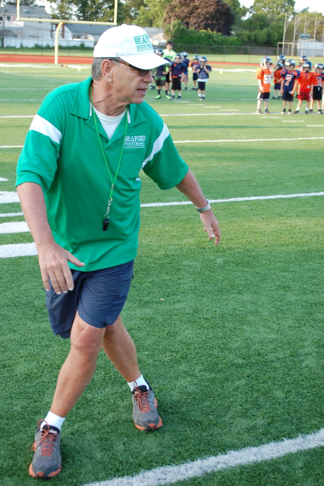 Vikings Head Coach Rob Perpall gave instructions to the Broncos during the two-day football camp at Seaford High School.
