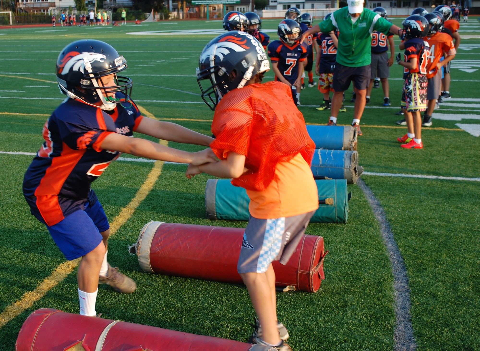 Tyler Evert, left, and A.J. Barone worked on their blocking skills during a camp which focused on the fundamentals of football.
