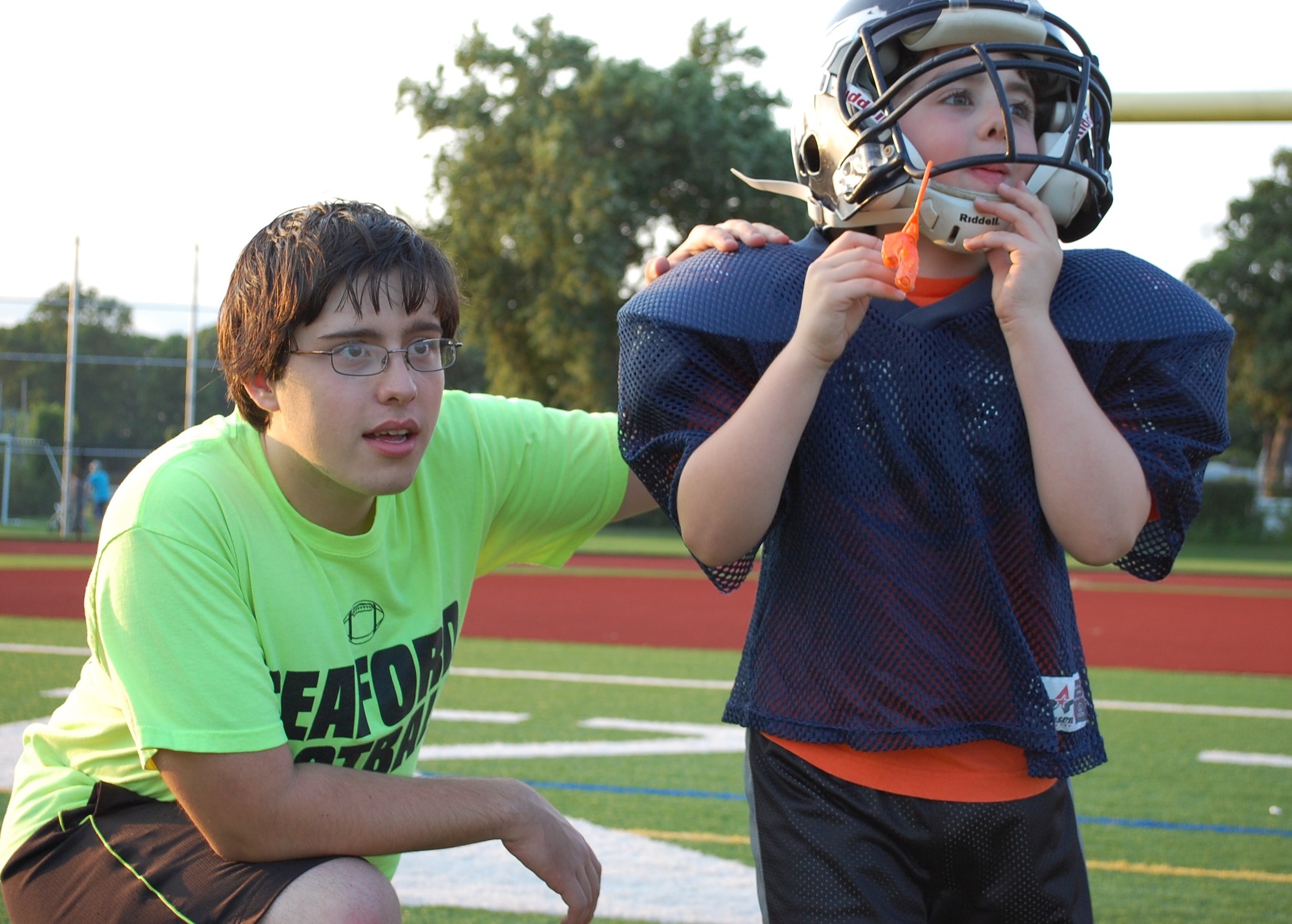 Senior Football player Dominick Porcelli gave some guidance to Matthew Schuh of the Broncos during one of the instructional drills.