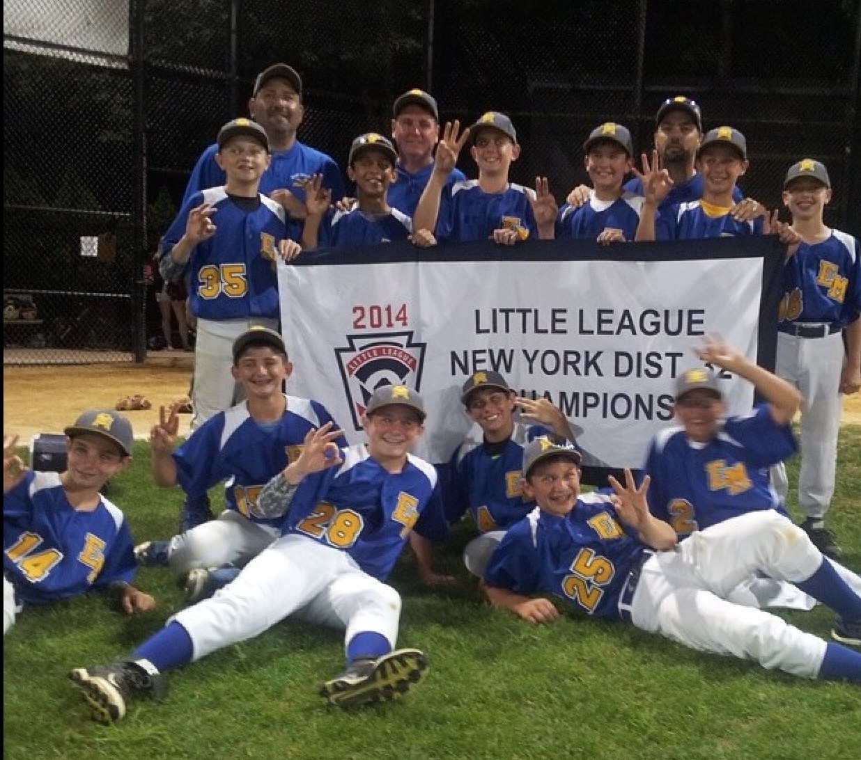 The 12u Mustangs Little League team have won three straight district titles. Above, they celebrated the more recent championship last month.