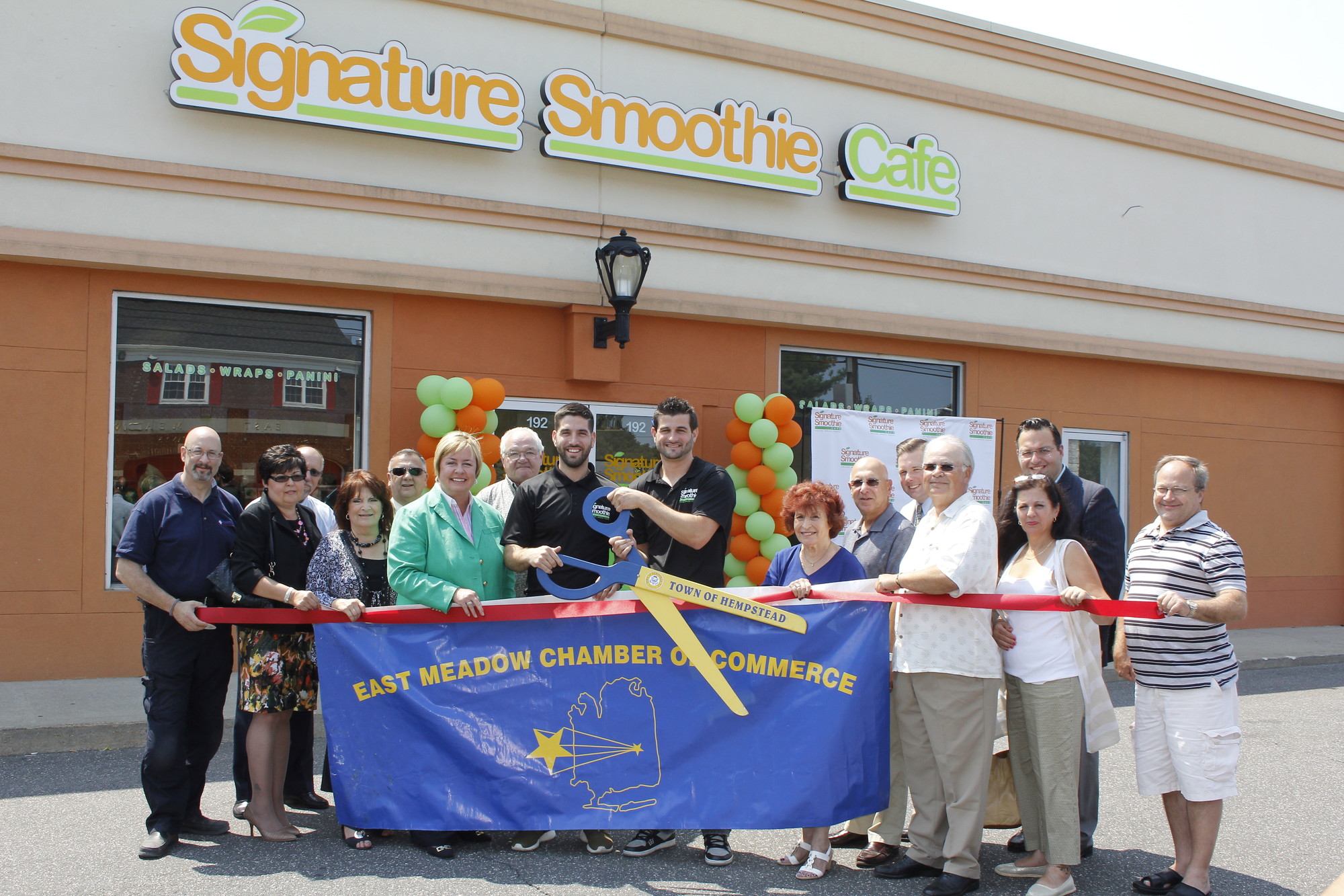 The Pastel brothers, surrounded by county, state and town officials, and members of the East Meadow Chamber of Commerce, celebrated the grand opening of Signature Smoothie, on 192 East Meadow Ave.