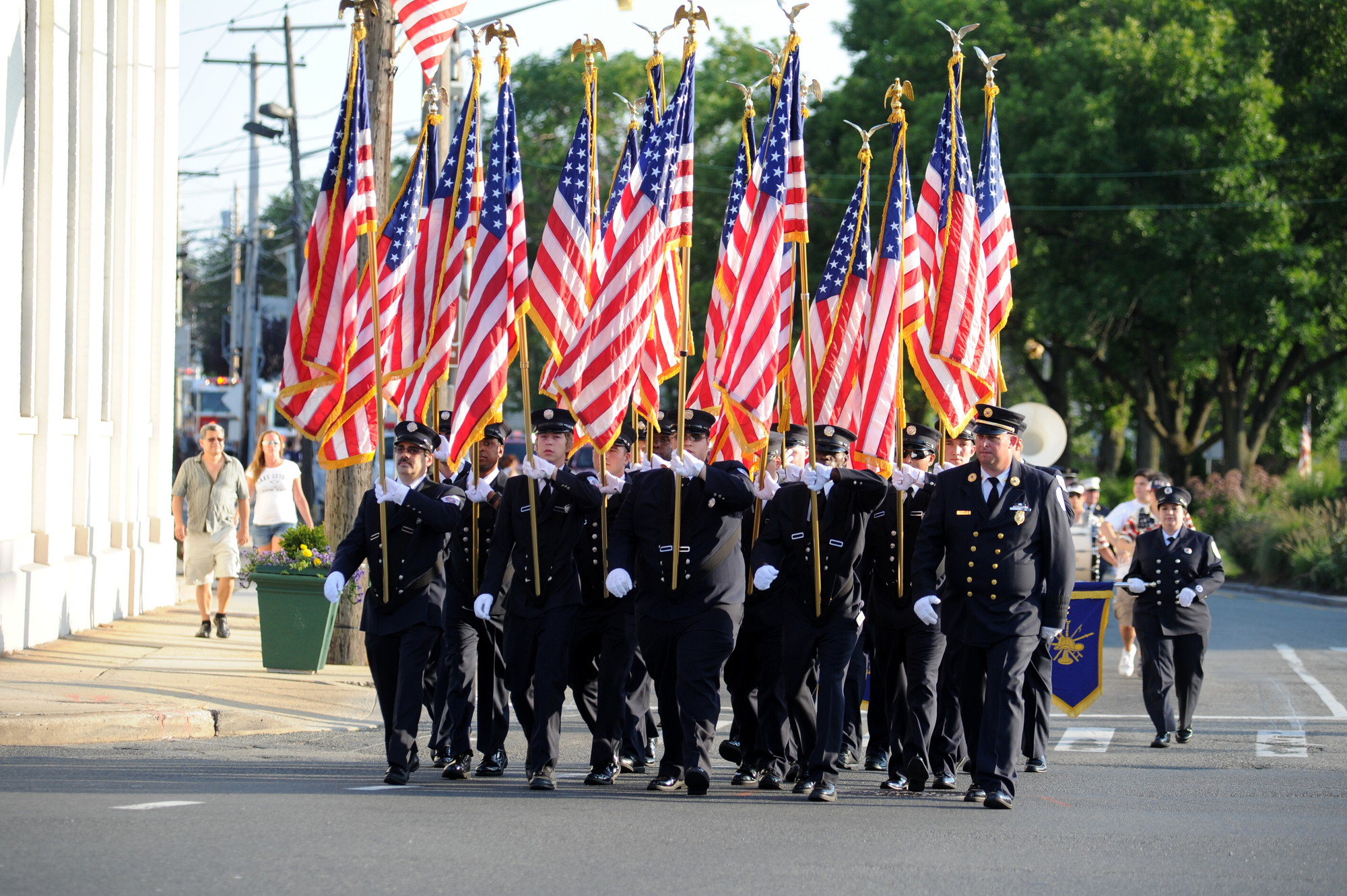 The color guard of the Baldwin Fire Department marched solemnly down Baldwin streets on Saturday.