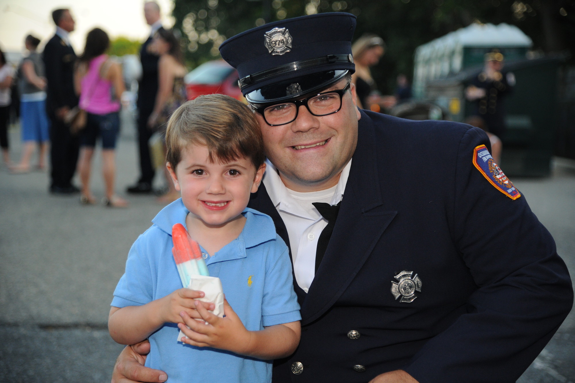 Sean Wayne, of the Oceaniside Fire Department, with his son, Gavin, 3.