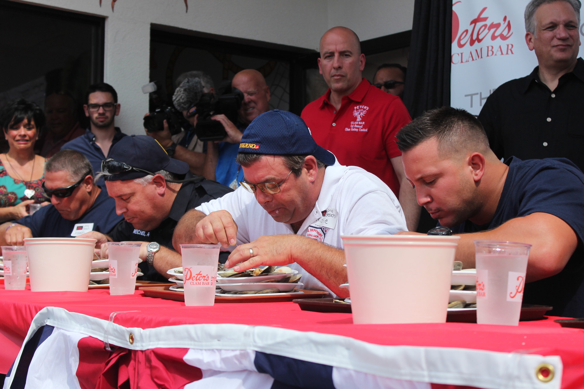 Firemen from several South Shore fire departments participated in the first Clam Eating Contest at Peter’s Clam bar in Island Park.