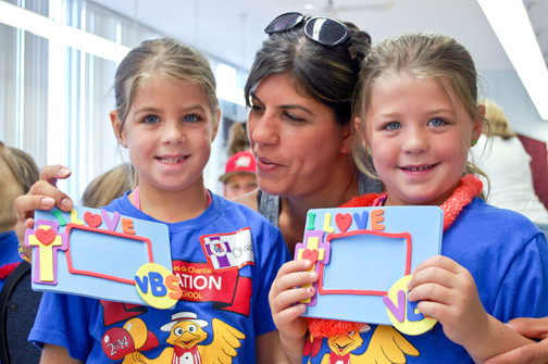 Andrea Clarkson admired the photo frames completed by her twin 6-year-olds, Olivia, left, and Abigaile.
