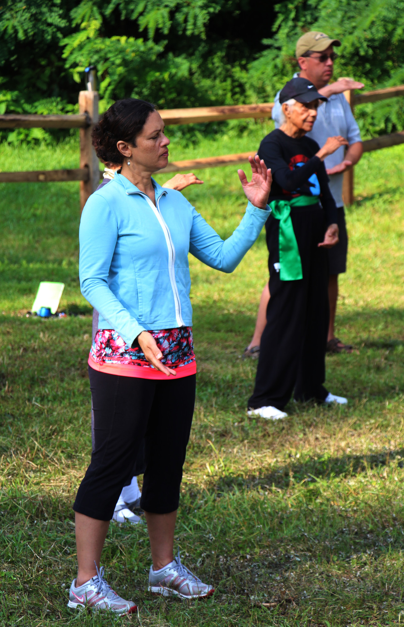 Brunila Alvarado, left, Lois Rhynie, an 84-year-old tai chi instructor and Richard Perez each attended the class over the weekend.
