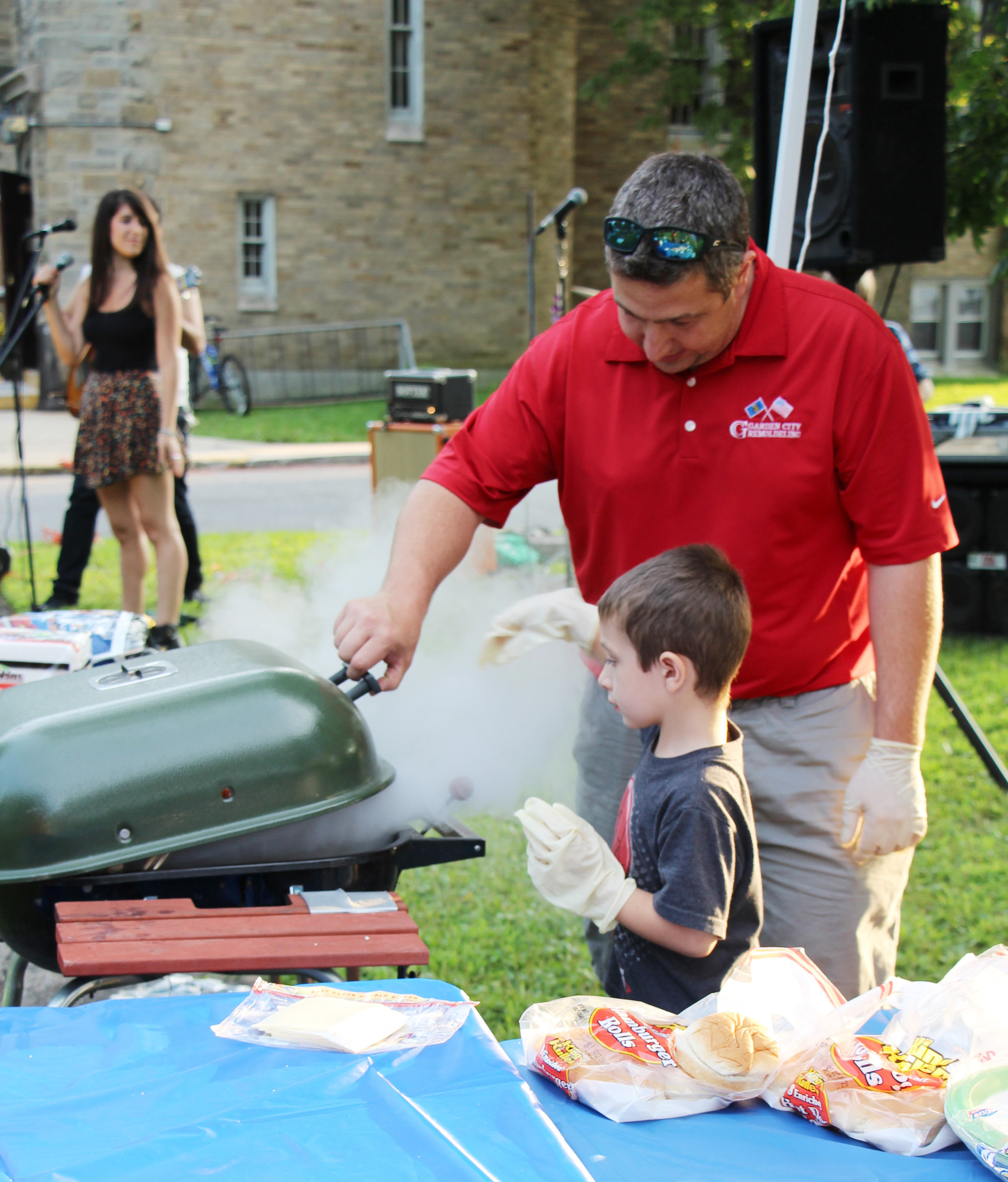 Mike Nickich and his son Mikey served burgers, hot dogs and other snacks to the crowd at St. Mark’s Church.