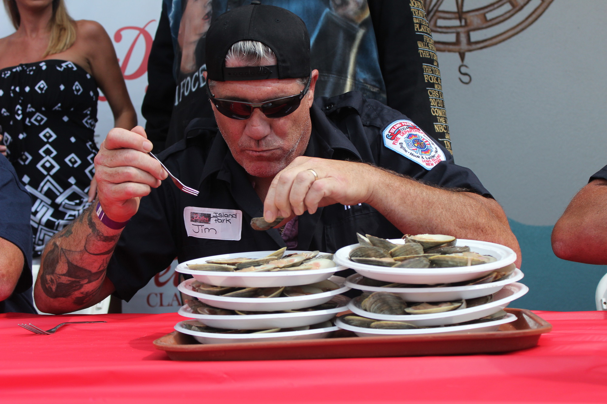 Jim Sarro, representing the Island Park Fire Department, dug into a pile of eight dozen clams last Sunday at the Peter’s Clam Bar Clam Eating Contest.