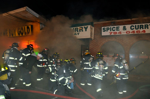 The EMFD, shown fighting a fire on Hempstead Turnpike last year, will receive new breathing apparatuses.