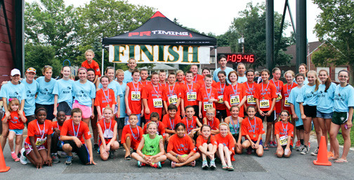 The participantS, volunteers and coaches after the Aug. 1 Fly With The Owls Middle School Triathlon program.