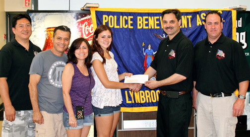 Members of the Lynbrook PBA presented a scholarship check to Lynbrook High School student.