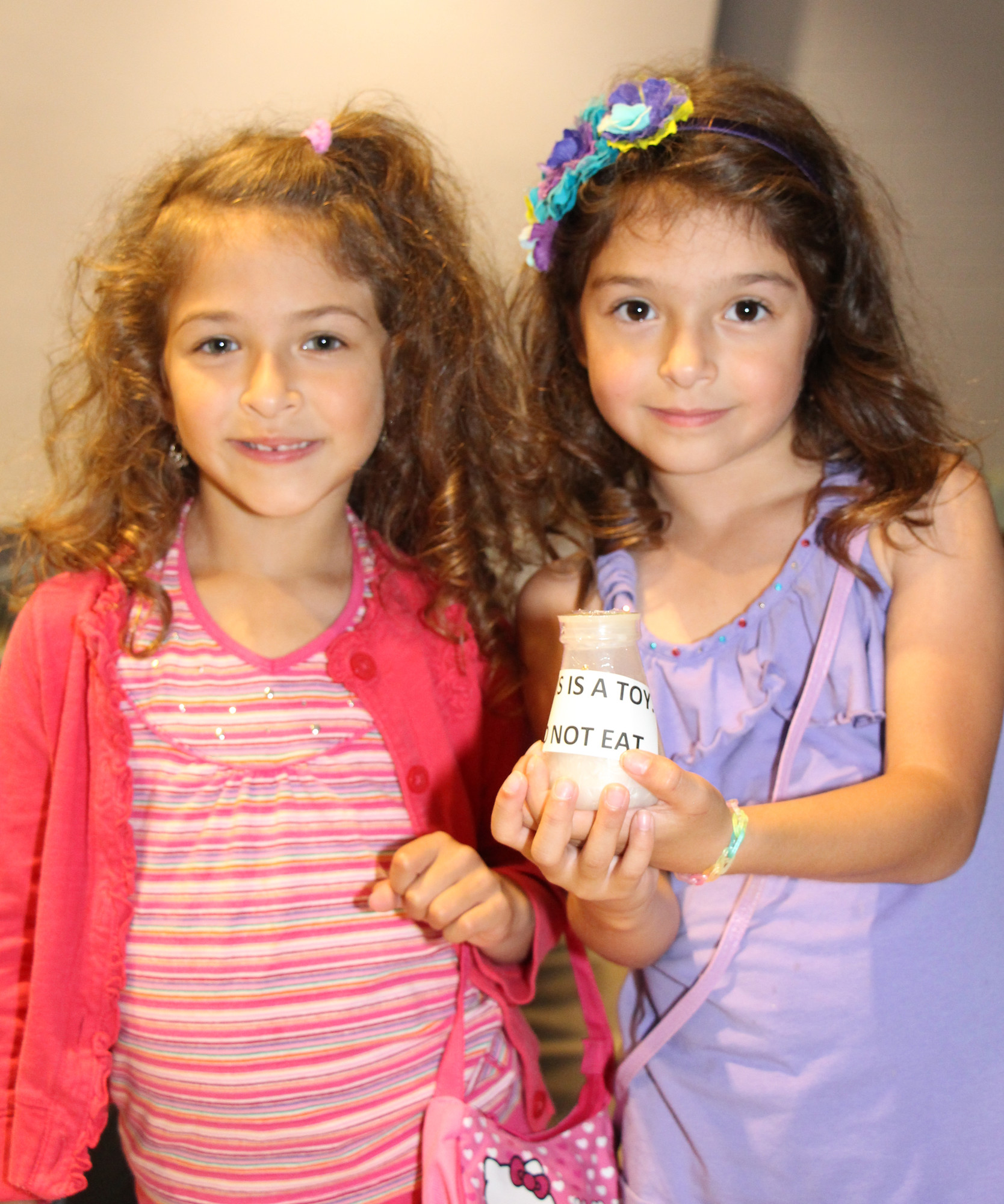 Sophia Tephly, 7, left, and Christina Tephly, 7, showed off a prize they won during the event.