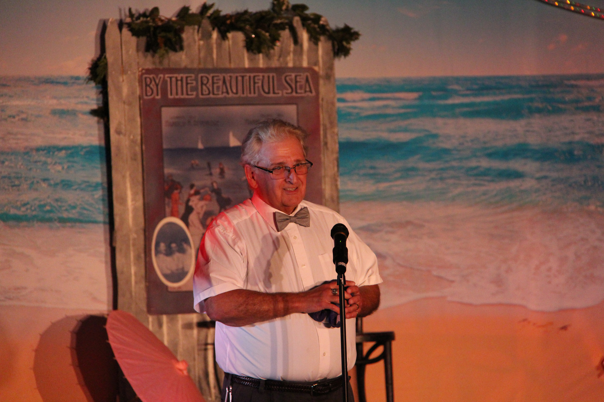 Johne Pane, president of the South Shore Theatricals board of directors, addressed the audience before the opening curtain of “A South Shore Summer” at the South Shore Jewish Center.
